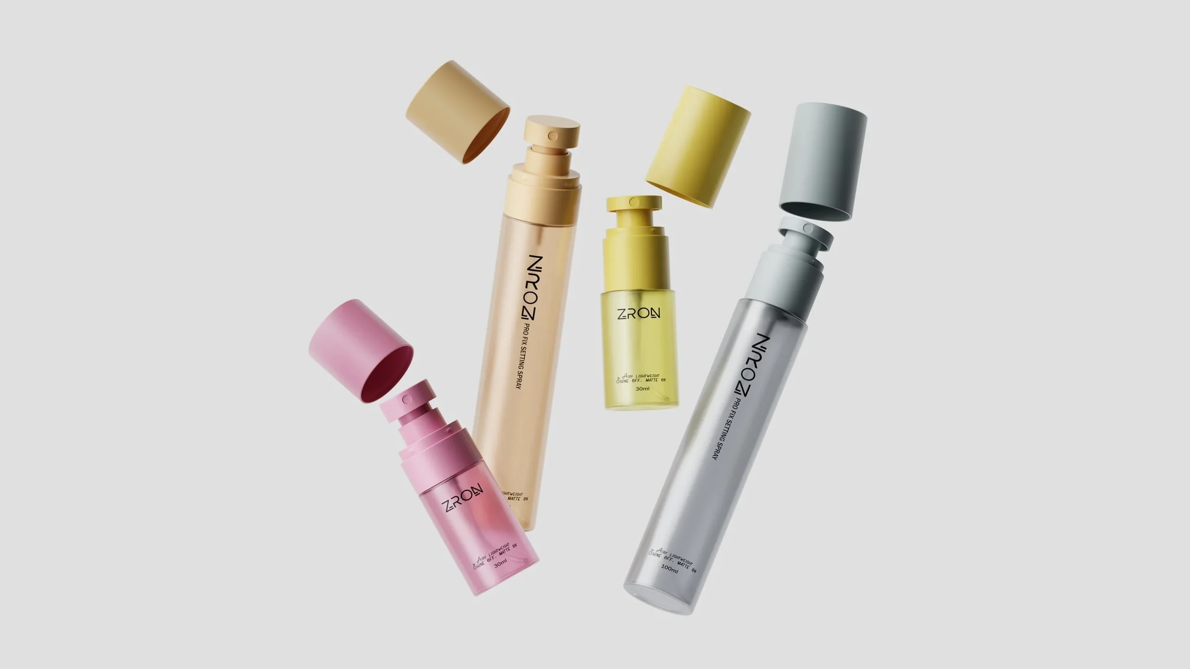 Pastel setting spray bottles with caps off